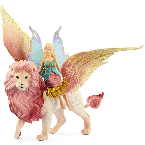 Schleich bayala elfje met roze en blauwe vleugels zit op een witte gevleugelde leeuw met roze manen.