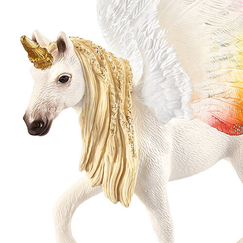 Detail van de kop en gouden manen van de Schleich gevleugelde regenboogeenhoorn.