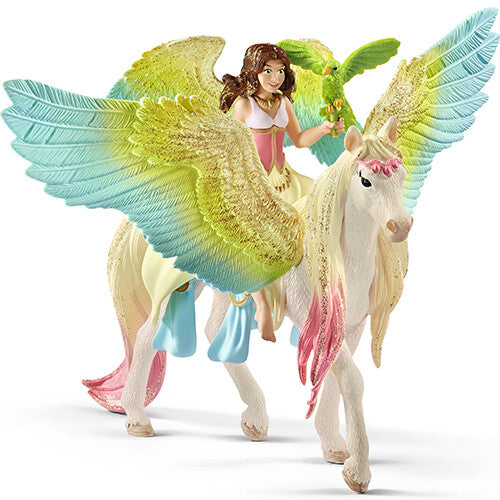 Schleich speelgoedfiguur van een fee met een regenboog glitterpegasus en een groene papegaai.