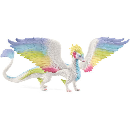 Schleich Bayala regenboogdraak speelgoedfiguur met gespreide regenboogkleurige vleugels.