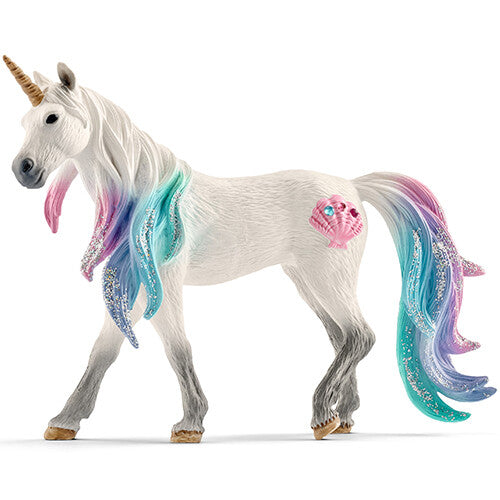 Schleich Bayala zee eenhoorn speelfiguur, wit met regenboogmanen en een roze schelp op de flank.