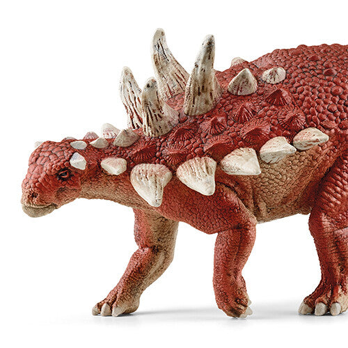 Detail van de kop en rug van het rode Gastonia dinosaurusspeelfiguur met stekels.
