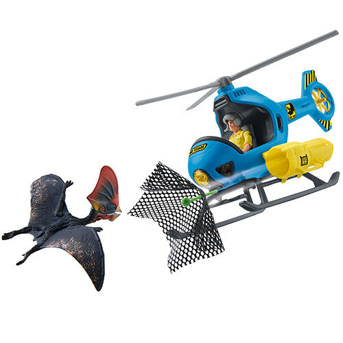Schleich dinosaurusspeelset met blauwe helikopter die een Pteranodon probeert te vangen met een net.