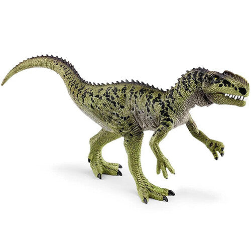 Schleich plastic dinosaurusfiguur van een groene Monolophosaurus, schuin van voren gefotografeerd.