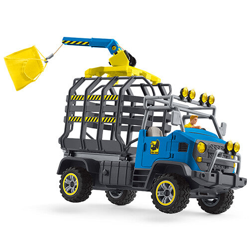 Schleich blauwe transporttruck met kooi en gele kraan die een gele zak tilt.