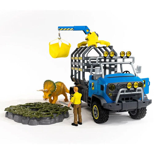 Schleich dinosaurusspeelset met blauwe transporttruck, kraan, triceratops en figuur.