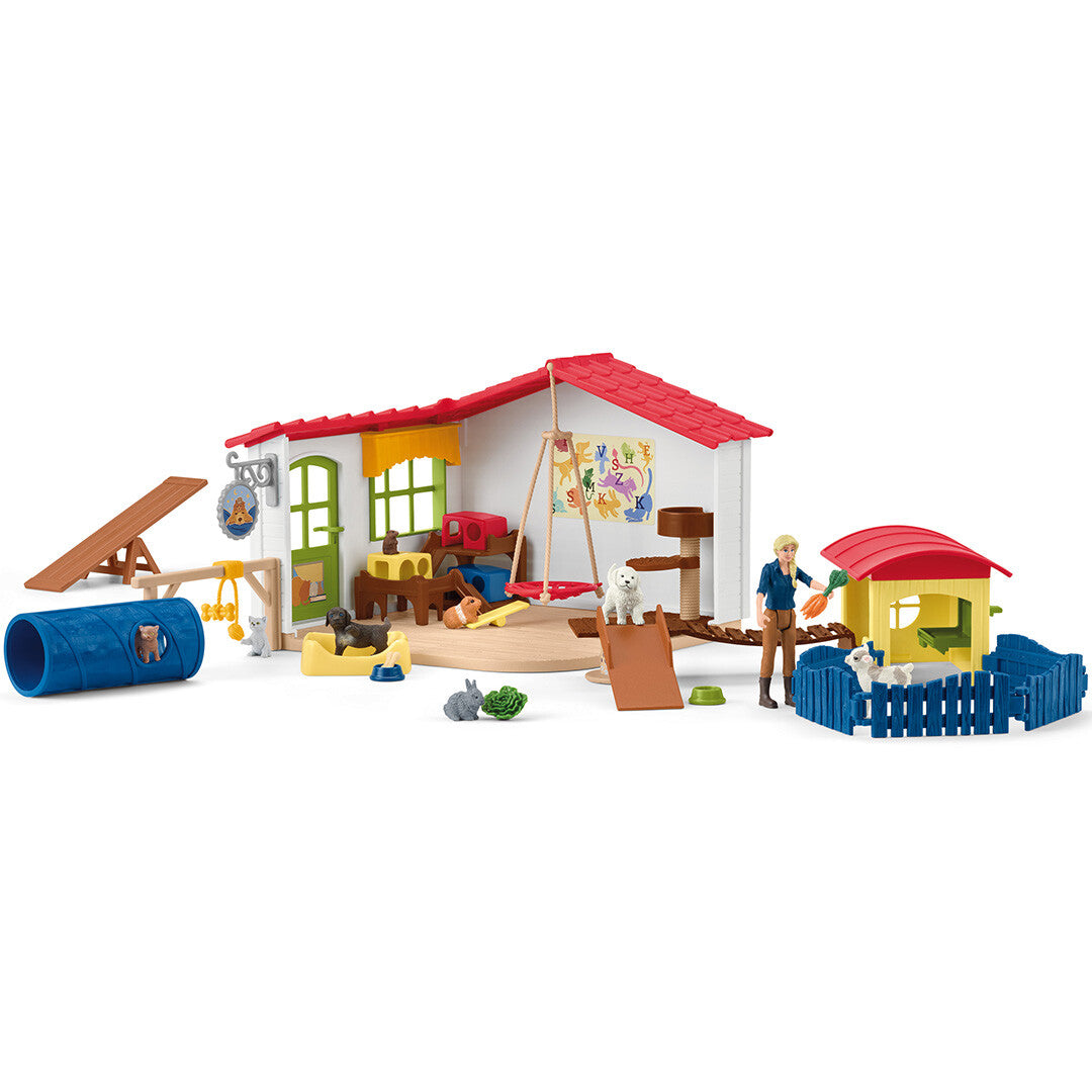 Schleich Farm World dierenhotel speelset met huis, mens- en dierfiguren en diverse accessoires.