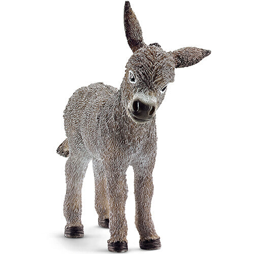 Schleich dierenfiguurtje van een grijs ezelveulen, staand.