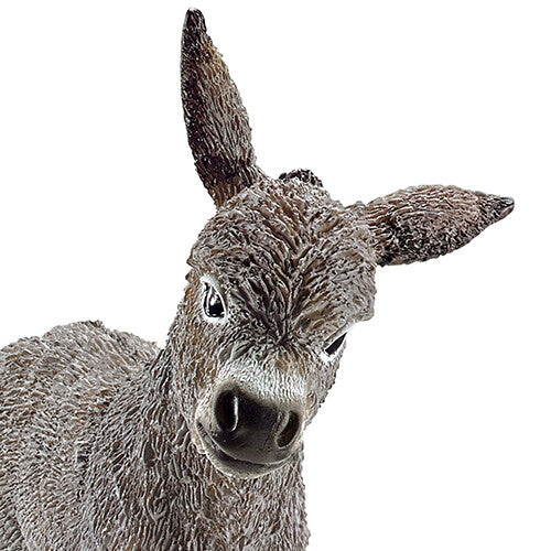 Detailopname van de kop en bovenkant van het Schleich ezelveulen dierenfiguurtje.