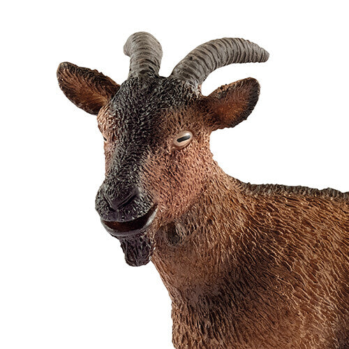 Detailopname van de kop van het Schleich dierenfiguurtje van een bruine geit.
