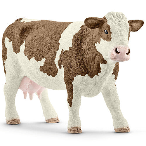 Schleich dierenfiguurtje van een bruin-wit gevlekte koe.