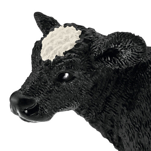 Detailopname van de kop van het Schleich Holstein zwartbont kalf speelgoedfiguur.