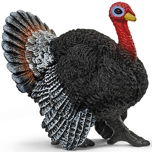 Schleich dierenfiguur van een zwarte kalkoen met rode kop en uitgespreide staartveren.