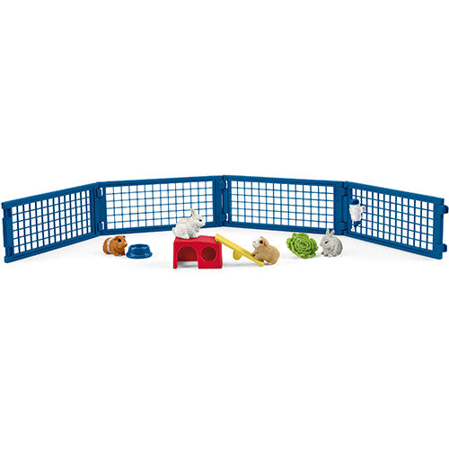 Schleich speelset met blauw hek, konijnen, cavia's, huisje en speeltoestellen.