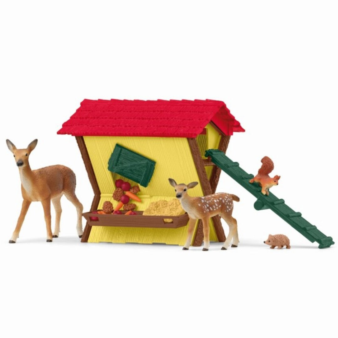 Schleich speelset met een voederplaats voor bosdieren, inclusief twee herten, een eekhoorn en een egel.