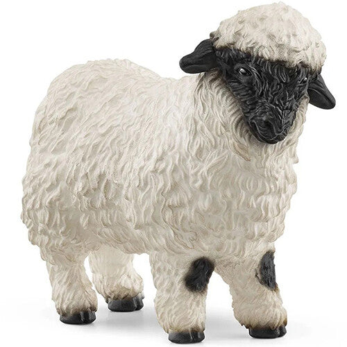 Schleich Walliser zwartneusschaap dierenfiguurtje met witte vacht en zwarte kop.
