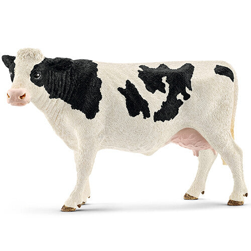 Schleich dierenfiguur van een zwartbonte koe, staand op een witte achtergrond.
