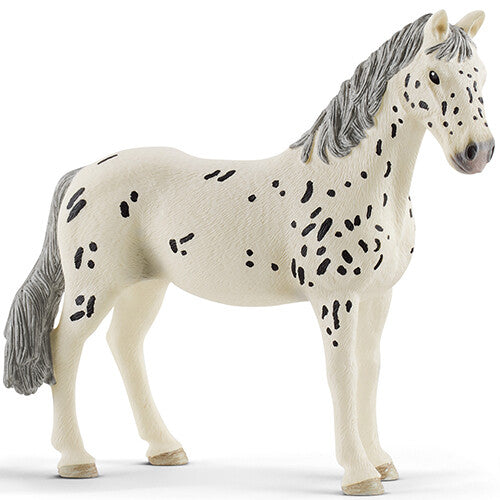 Schleich dierenfiguurtje van een beige Knabstrupper merrie met zwarte stippen.