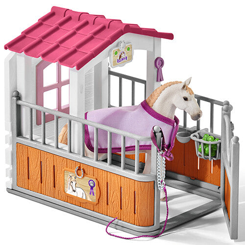 Schleich paardenbox speelset met wit paard met roze deken in de stal en voerbak.