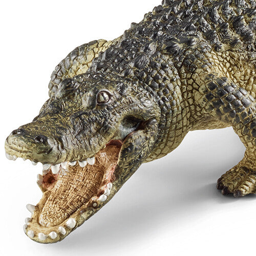Detailopname van de kop en open bek van het Schleich alligator dierenfiguurtje.