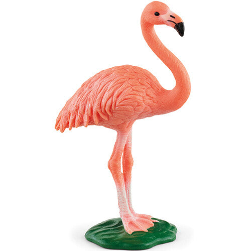Schleich roze plastic flamingo dierenfiguurtje staand op een groene ondergrond.