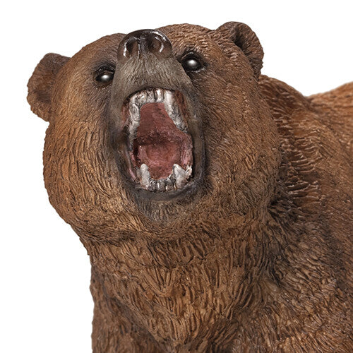 Detailopname van het brullende hoofd van het bruine grizzlybeer dierenfiguurtje.