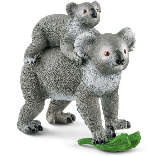 Schleich dierenfiguurtje van een koalabeer met een jong op de rug en een groen blad.