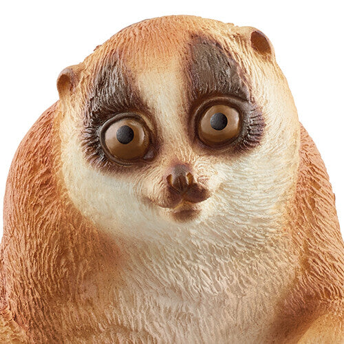 Detailopname van het gezicht van het Schleich plompe lori dierenfiguurtje.