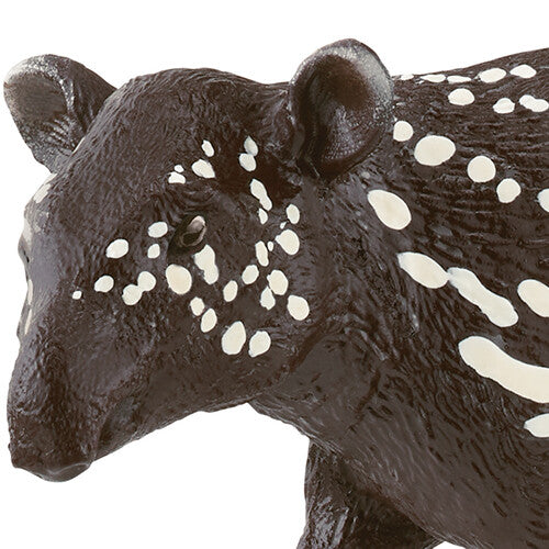 Detailopname van het Schleich wild life dierenfiguurtje van een tapirjong, met focus op de kop en de witte vlekken.