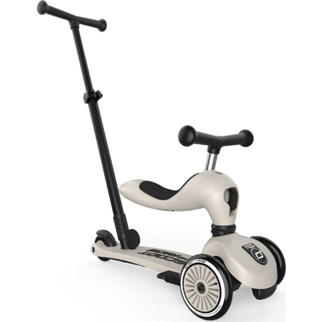 Een beige Scoot & Ride 2-in-1 loopfiets met zwart stuur en zitting.