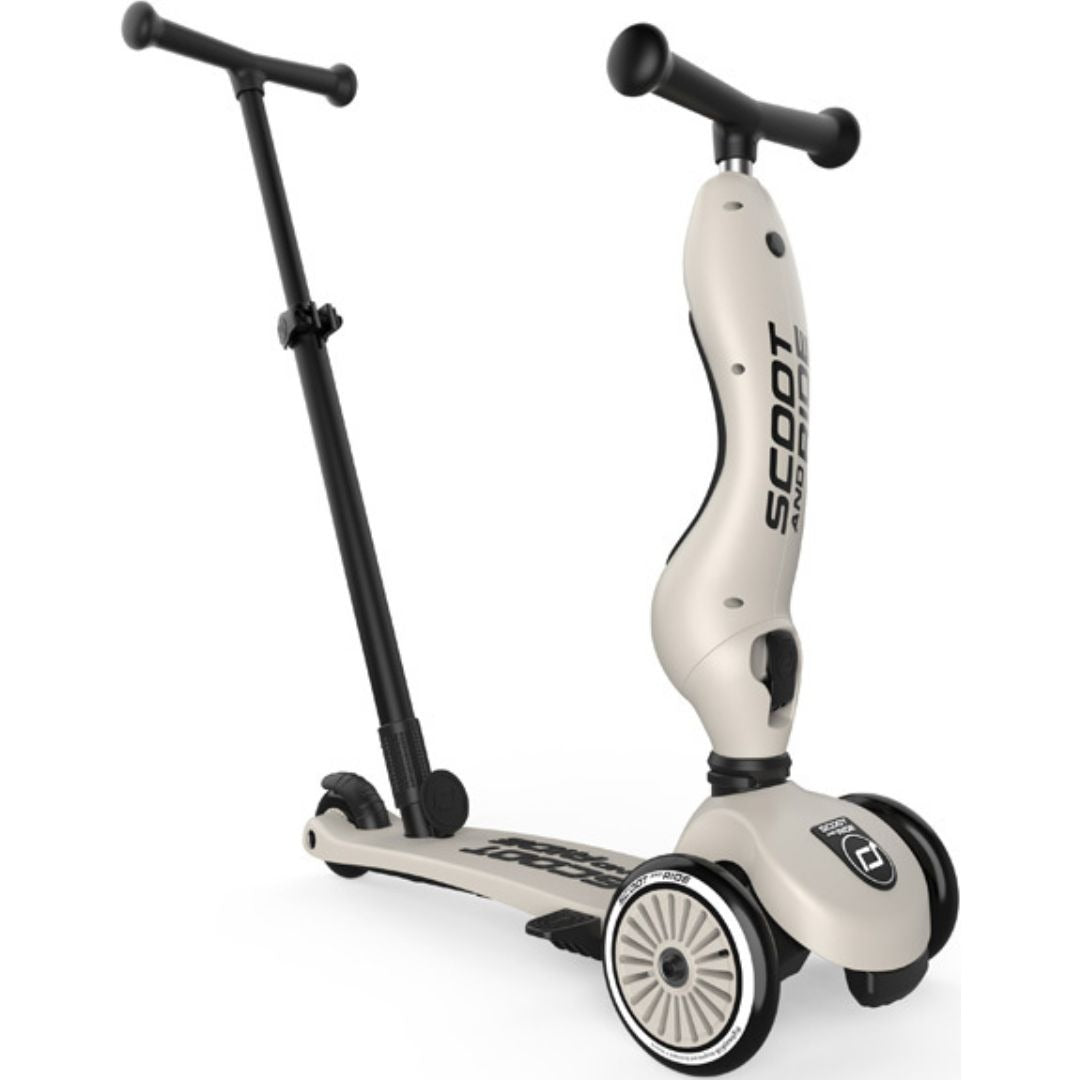 Een beige Scoot & Ride 2-in-1 step met zwart stuur.