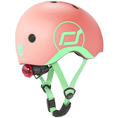 Scoot & Ride kinderhelm in roze met lichtgroene details en een rood achterlicht.