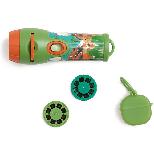 Bovenaanzicht van de groene en oranje scratch europe projectiezaklamp met dinosaurusafbeeldingen, twee projectieschijven en een groen opbergdoosje.