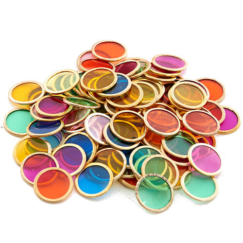 Shaw magnets sorteerschijfjes: een hoopje veelkleurige, ronde, doorzichtige schijfjes met metalen rand.