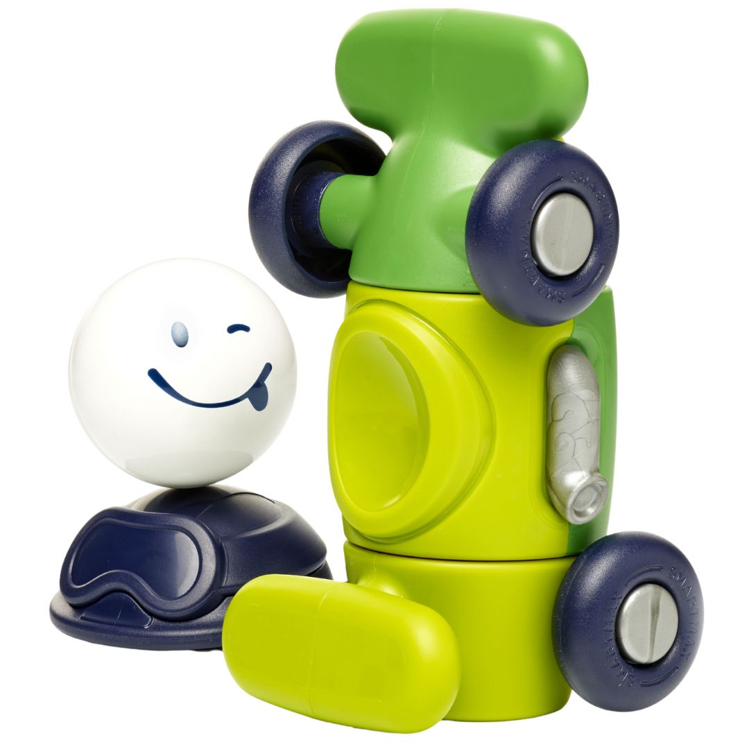 Gedemonteerde SmartMax magnetische auto bouwset met groene onderdelen en een wit hoofdje met een knipoog.
