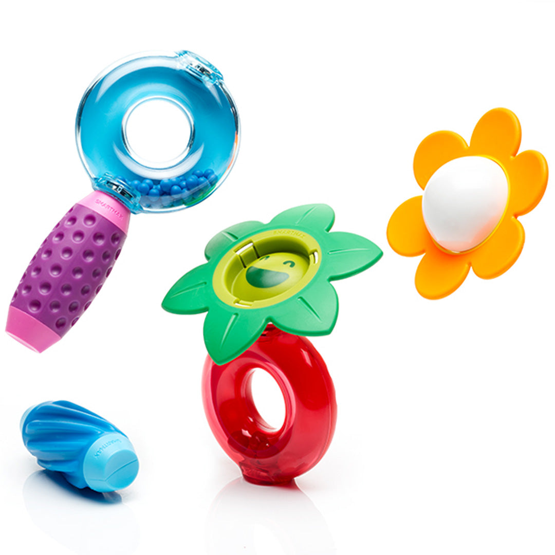 Diverse kleurrijke Smartmax magnetische bouwstukken, waaronder een vergrootglas en bloemvormen.