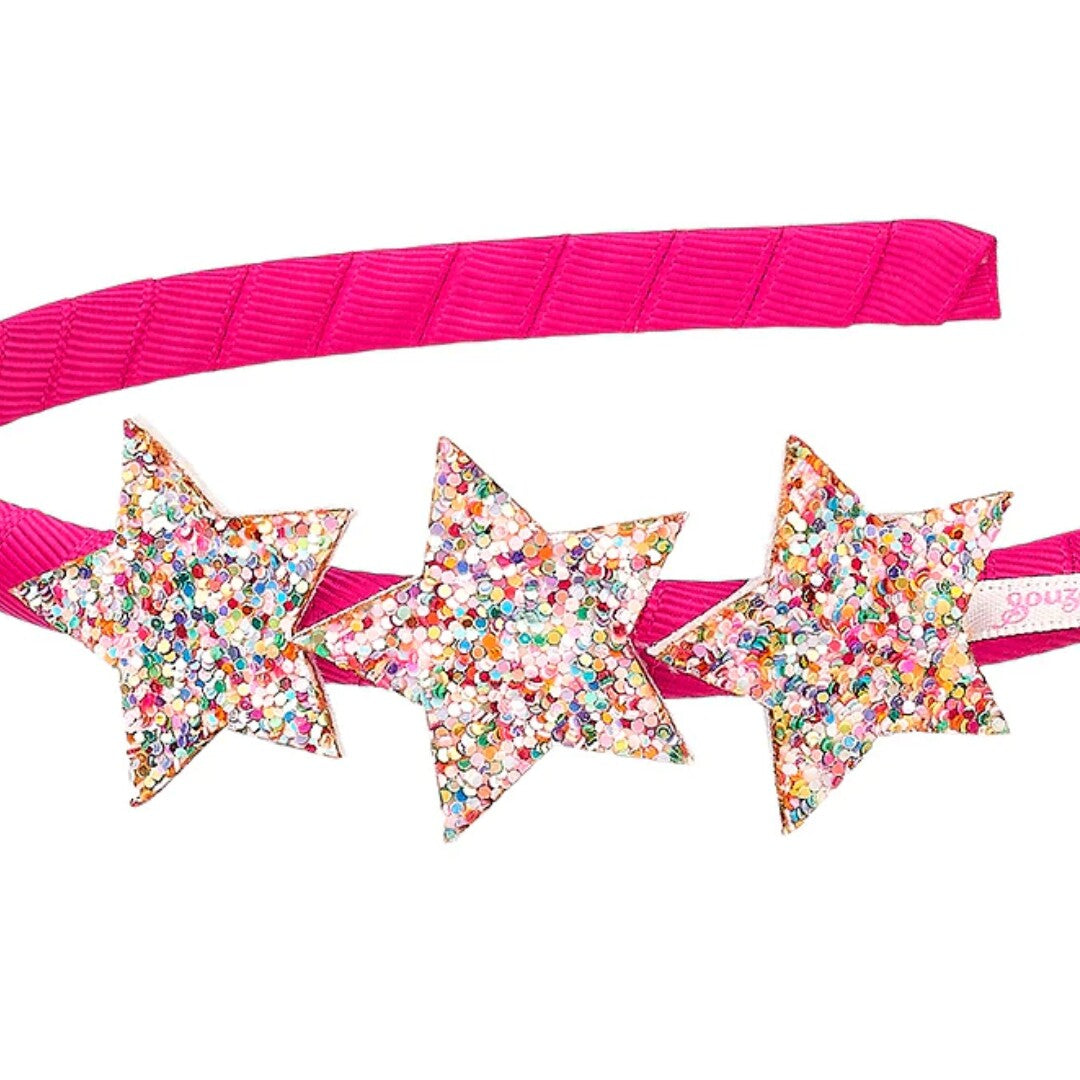 Detail van de Souza for Kids roze kinder hoofdband met glitter sterren.