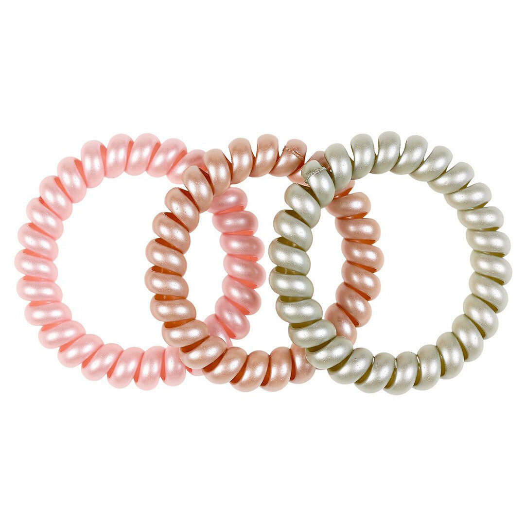 Drie Souza for Kids spiraal haarelastiekjes voor kinderen in pastelkleuren roze, perzik en lichtgrijs.