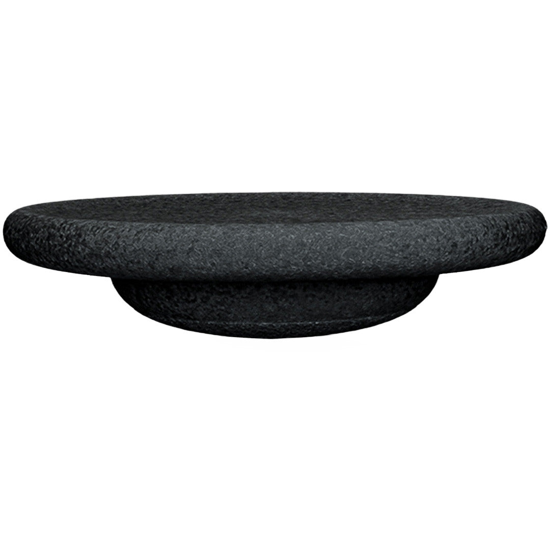 Zwart stapelstein balance board, van de zijkant gefotografeerd.