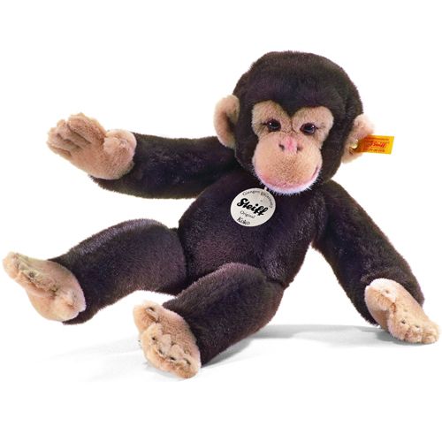 Steiff chimpansee Koko pluchen speelgoed, liggend met gespreide armen en benen.