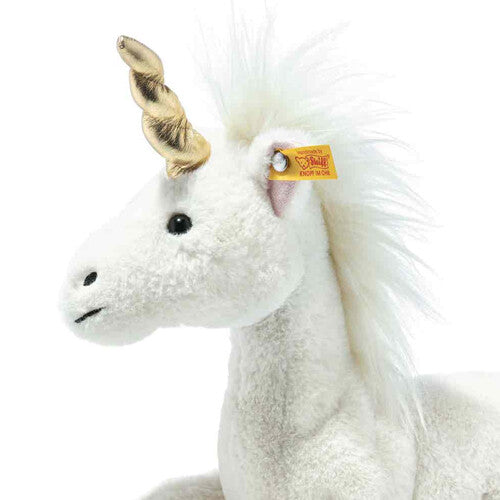 Detailfoto van de kop van de Steiff pluchen eenhoorn Unica met gouden hoorn en Steiff-label.