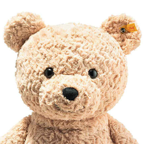 Close-up van het gezicht van de Steiff teddybeer Jimmy met het merklabel in zijn oor.
