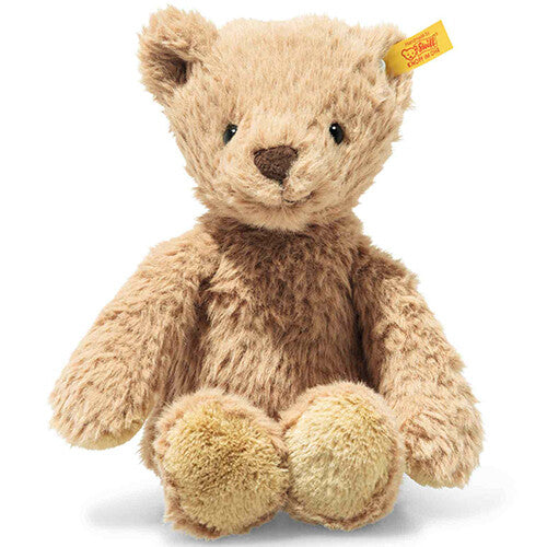 Steiff pluchen teddybeer Thommy in karamelkleur, zittend en frontaal gefotografeerd.