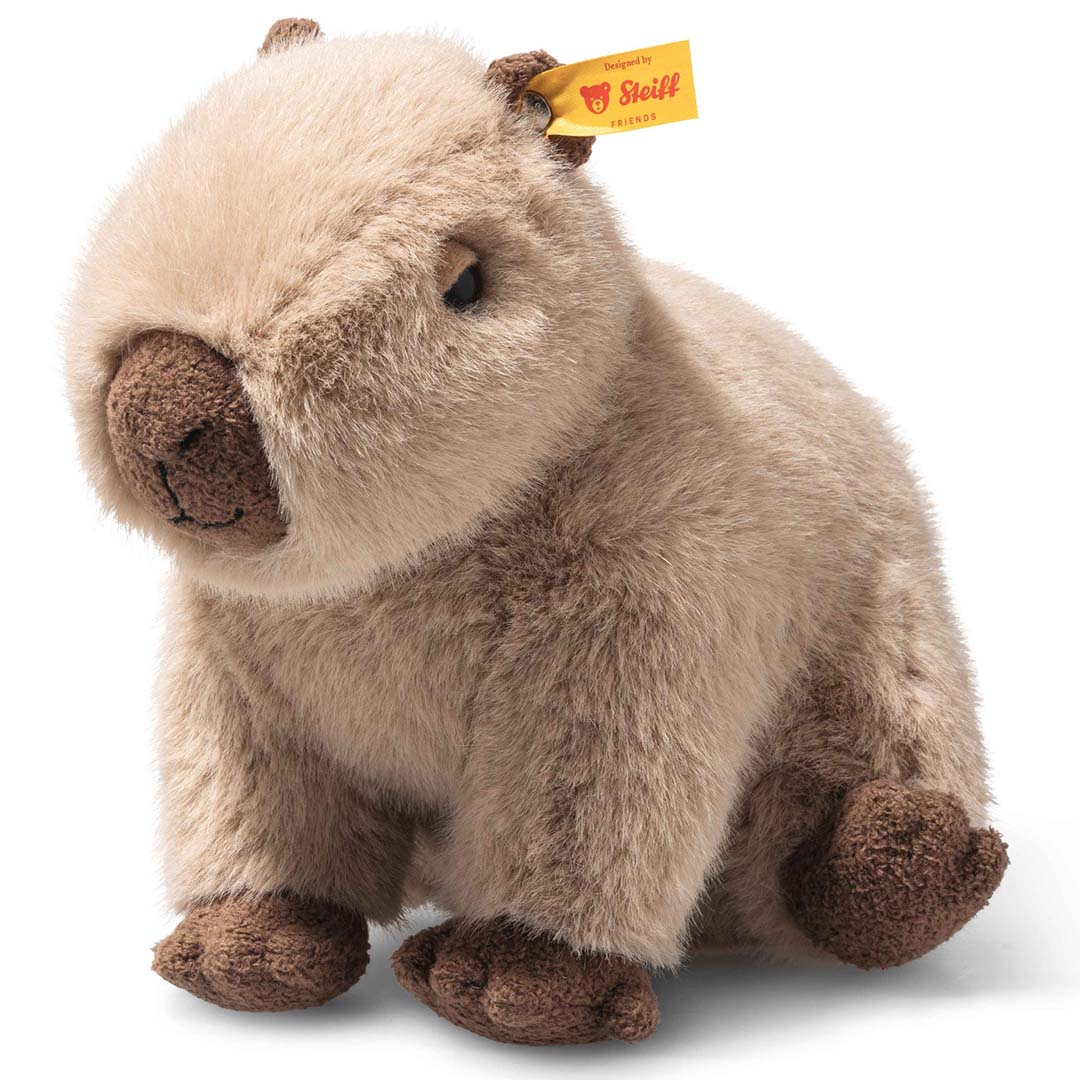 Steiff knuffel capibara, beige en bruin, schuin van voren gefotografeerd.