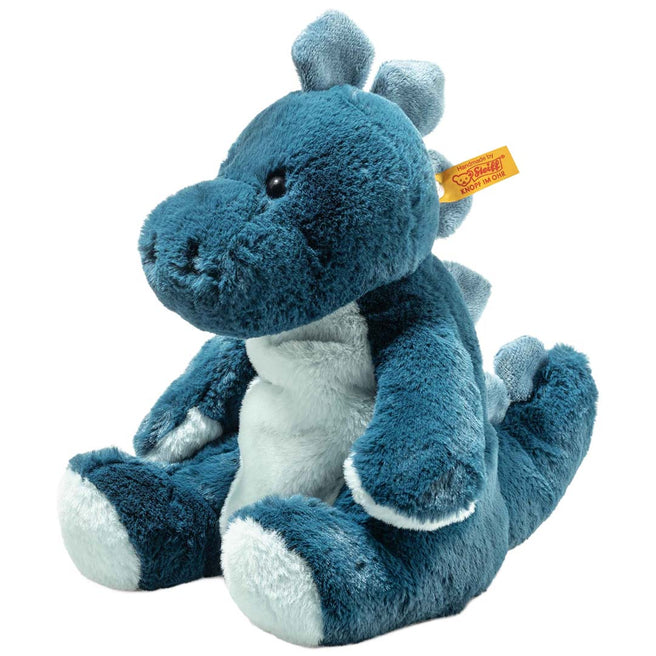 Steiff knuffeldinosaurus Spott met nachtlampje, zittend op een witte achtergrond.