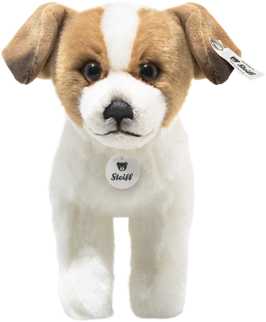 Steiff knuffelhond terriër, wit met bruine vlekken, recht van voren gefotografeerd.
