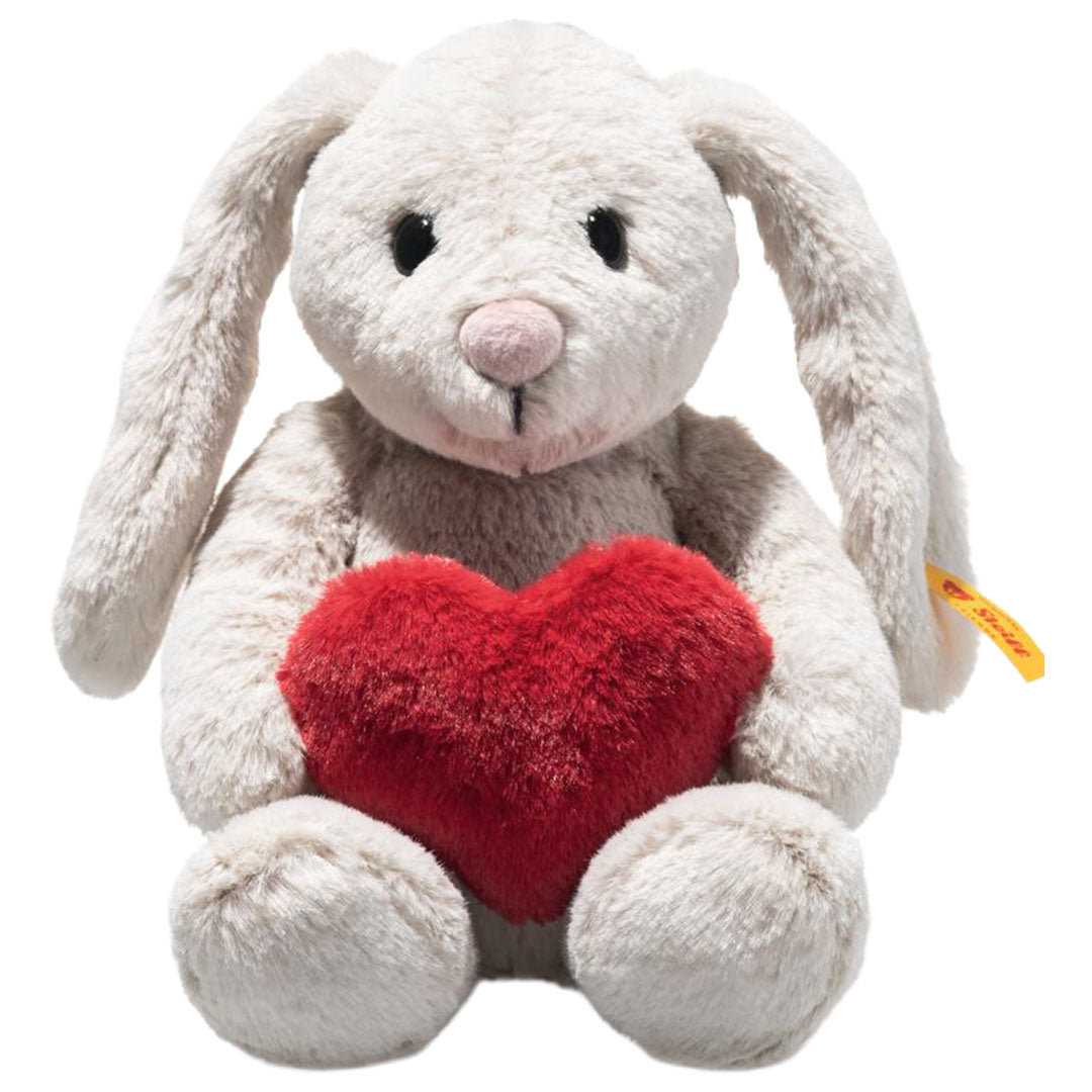 Steiff knuffelkonijn Hoppi Love grijs met een rood hart.