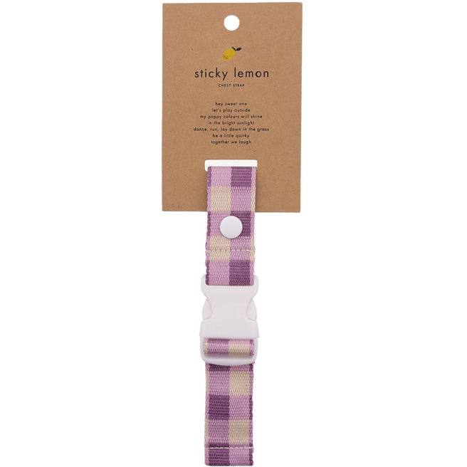 Sticky Lemon borstriem voor rugzak met paars en beige geruit patroon en witte gesp, op de verpakking.