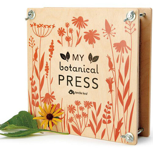 Tender Leaf Toys houten bloemenpers met een gele bloem en blad ernaast.