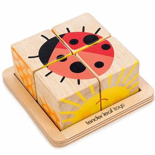 Tender Leaf Toys houten blokkenpuzzel met vier blokken die samen een lieveheersbeestje vormen in een houten bakje.